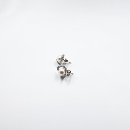 An evil eye pearl studs from ekatvajewls